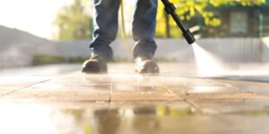 man-using-electric-pressure-washer-power-wash-concrete-driveway-sunny-morning-concept-power-washing-concrete-driveway-electric-washer-sunny-morning-outdoor-cleaning